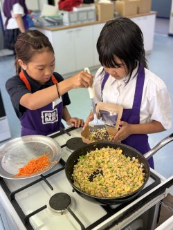 Girls serving fried rice